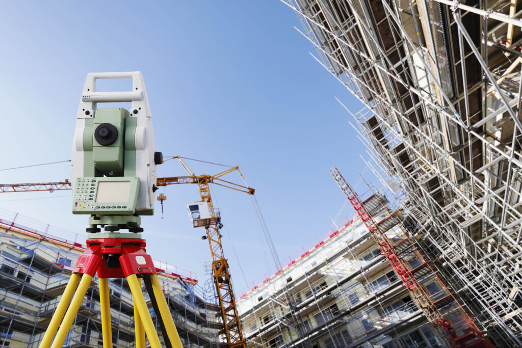 Surveyors,Measuring,Instrument,,Close ups,,Large,Super wide,Construction,Site,In,Background